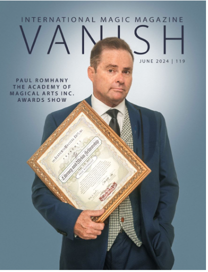 Paul Romhany holding an Academy of Magical Arts award certificate
